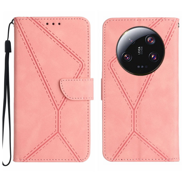 Pink embossed leather flip phone case with stitched pattern and wrist strap loop