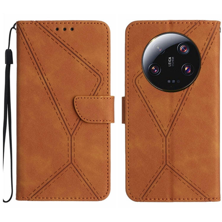Brown embossed leather flip phone case with stitched pattern and wrist strap loop