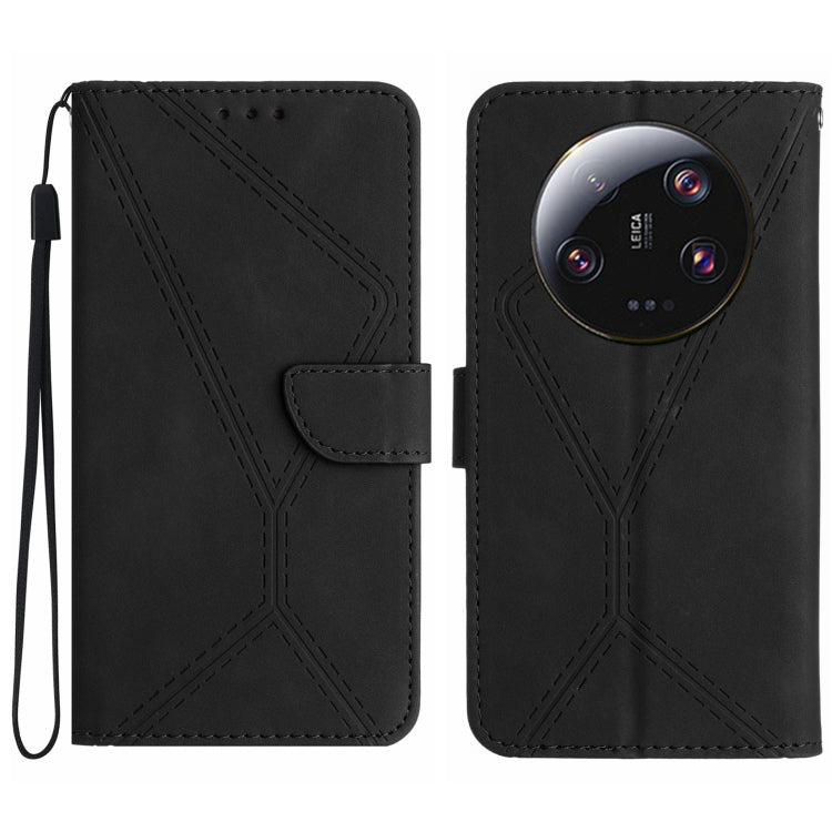 Black embossed leather phone case with stitched geometric pattern and wrist strap.