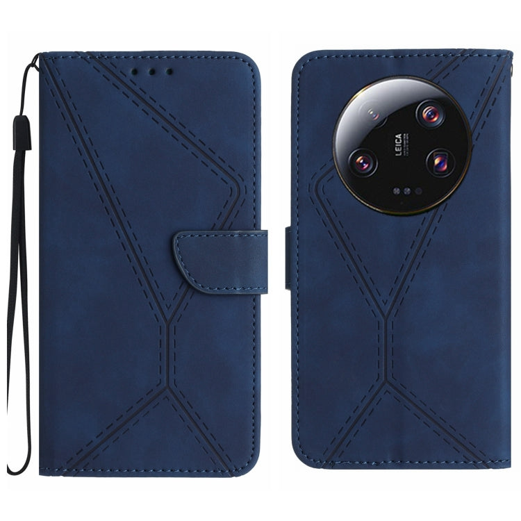 Blue embossed leather phone case with stitched geometric pattern and wrist strap.