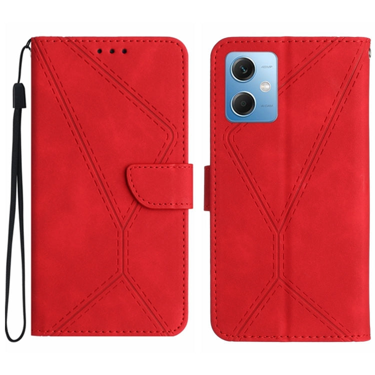 Red embossed leather phone case with stitched geometric pattern and flip strap, camera cutout
