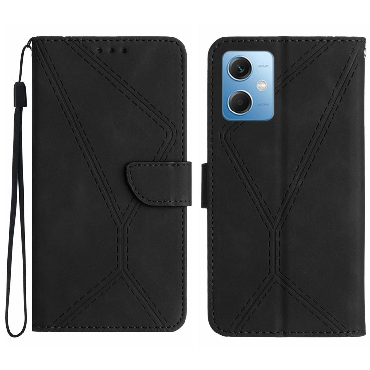 Black embossed leather phone case with stitching pattern and card flap, wrist strap loop