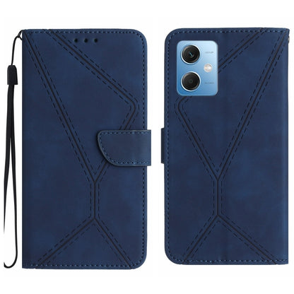 Blue embossed leather phone case with stitching pattern and card flap, wrist strap loop