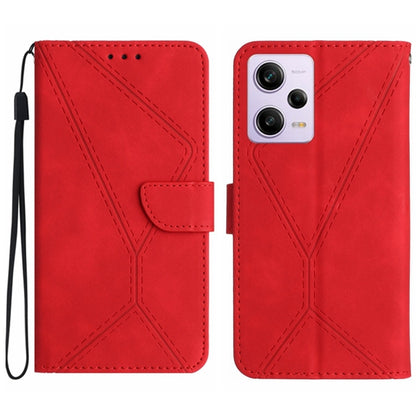 Red embossed leather phone case with stitched geometric pattern and flip strap, camera cutout