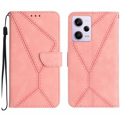 Pink leather phone case with stitched geometric embossing and flip pocket, wrist strap