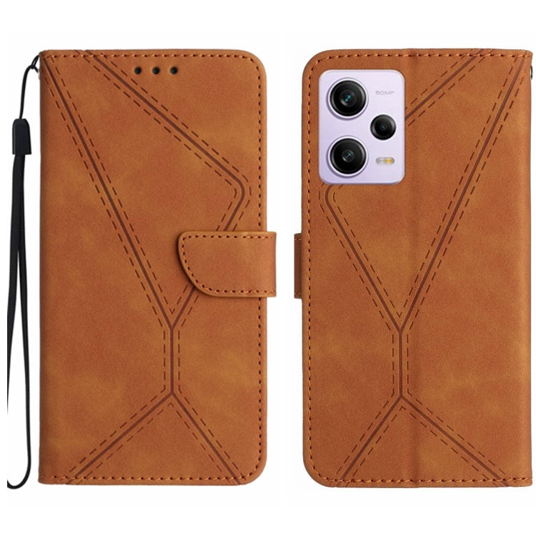 Brown leather phone case with stitched geometric embossing and flip pocket, wrist strap