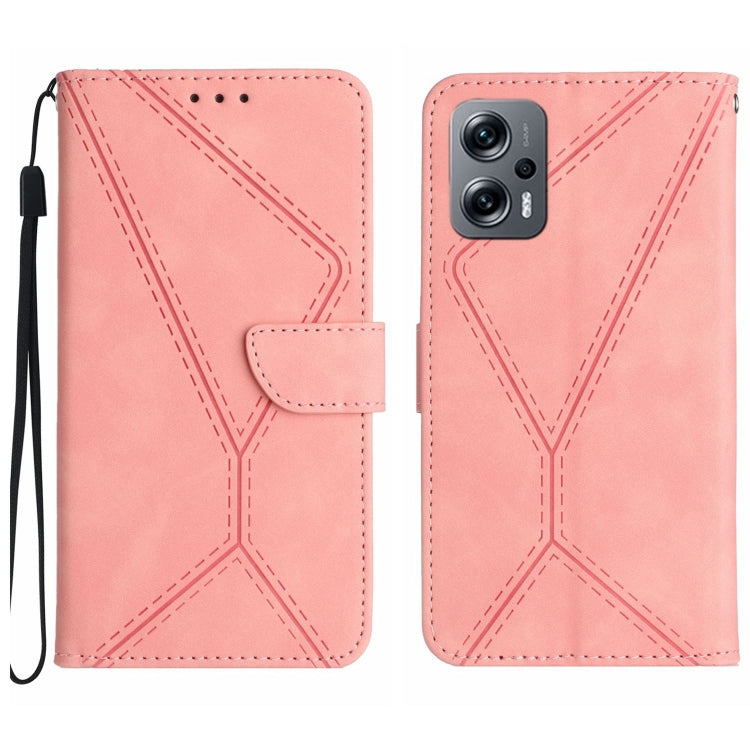 Pink embossed leather phone case with stitched geometric pattern and wrist strap.