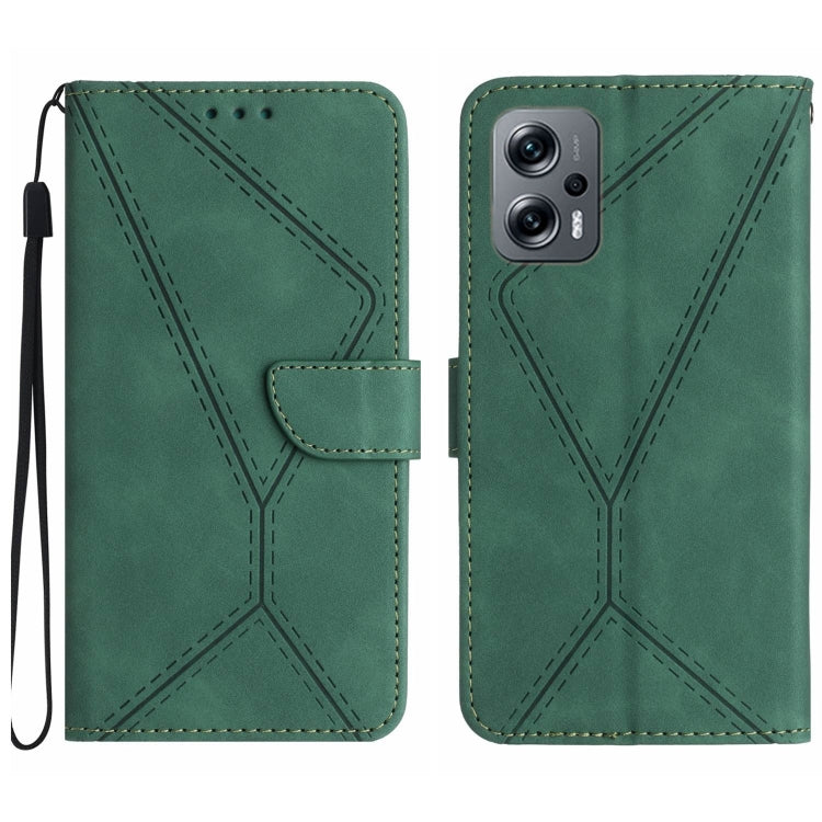 Green embossed leather phone case with stitched geometric pattern and wrist strap.