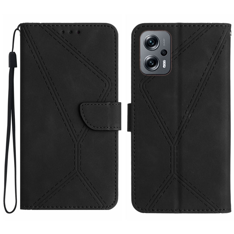 Black embossed leather phone case with stitched geometric pattern and wrist strap.