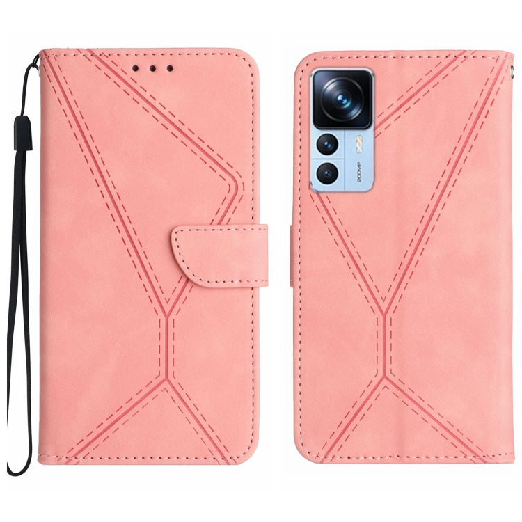 Light pink faux leather phone wallet case with embossed geometric stitching, flip flap, wrist strap.