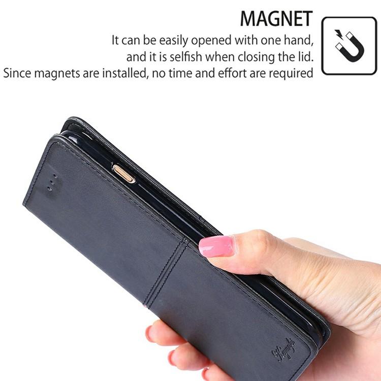 Magnetic leather wallet phone case, black, slim flip cover held in hand