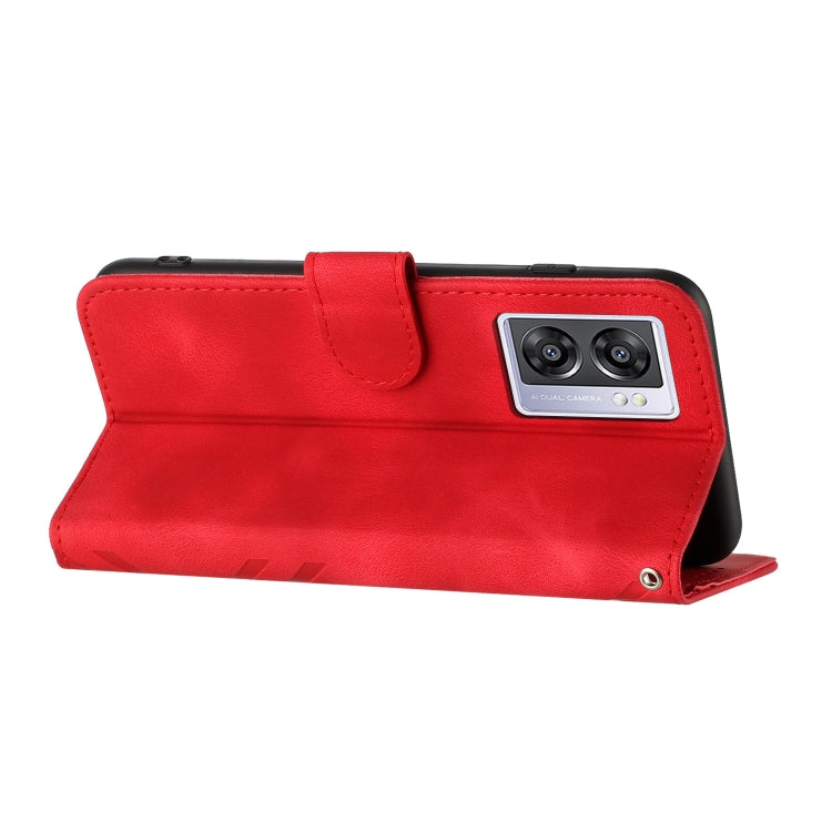 Red leather wallet phone case with top flap and camera cutout.