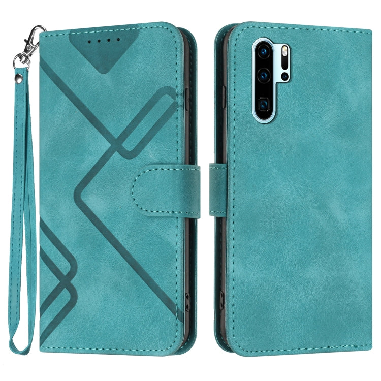 Teal leather phone case with geometric line pattern, flip cover and wrist strap.