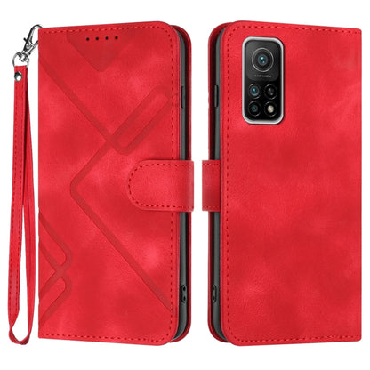 Red leather wallet phone case with wrist strap, geometric pattern, and card slot flap