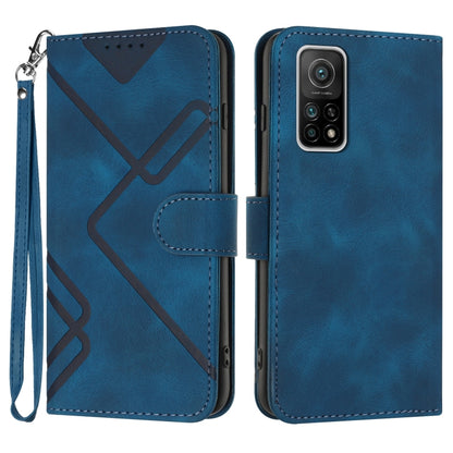 Blue leather wallet phone case with wrist strap, geometric pattern, and camera cutout