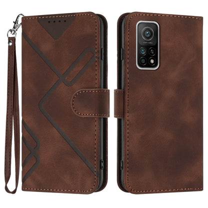 Brown leather wallet phone case with wrist strap, geometric pattern, and camera cutout