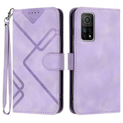 Light purple leather wallet phone case with wrist strap, geometric pattern, and camera cutout