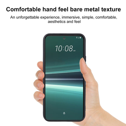 Black TPU phone case fitted to a smartphone, raised edge around the screen