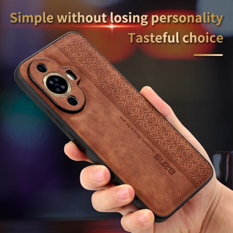 Brown phone case with 3D embossed geometric texture, raised dual-camera housing.