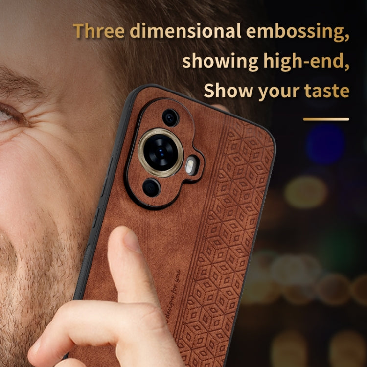 Brown phone case with 3D embossed pattern and raised dual-camera cutout for protection.