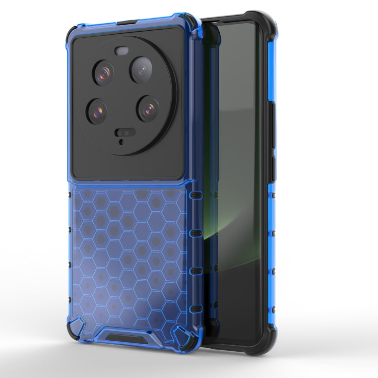 Shockproof honeycomb phone case in blue with raised camera and screen-protecting edges.