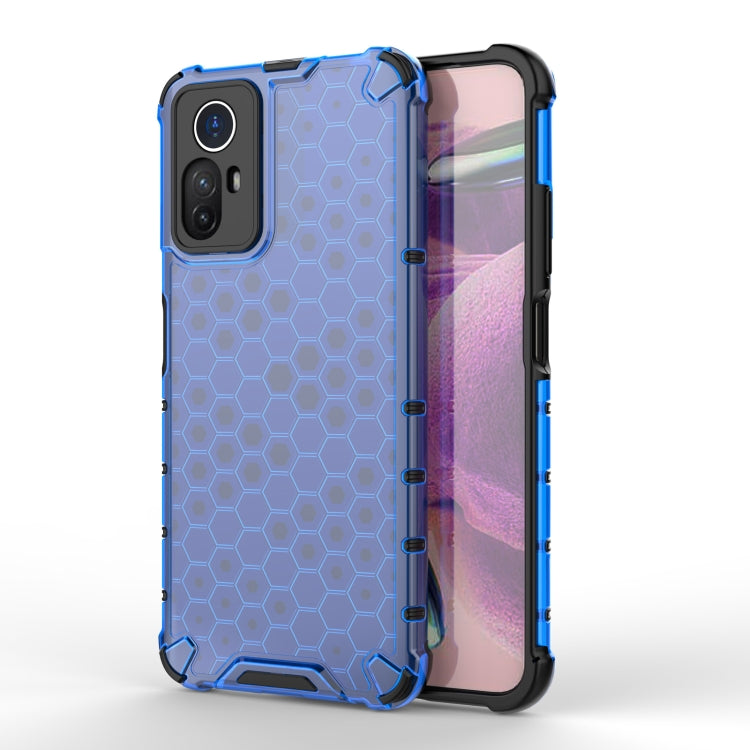 Blue shockproof honeycomb phone case with camera cutout and screen-edge guard.