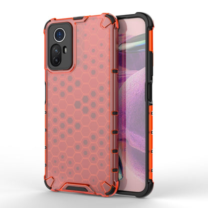 Orange shockproof honeycomb phone case with screen-side protection and camera cutout.
