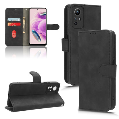 Black leather flip phone case with magnetic closure and cutouts for camera and buttons
