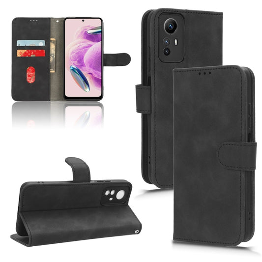 Black leather flip phone case with magnetic closure and cutouts for camera and buttons
