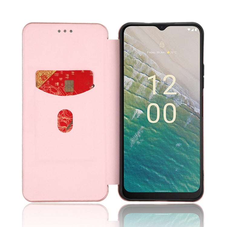 Pink flip phone case with stand-style front cover and magnetic closure, phone screen visible.