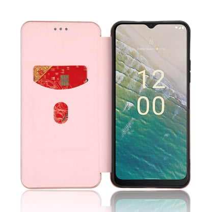 Pink flip phone case with stand-style front cover and magnetic closure, phone screen visible.