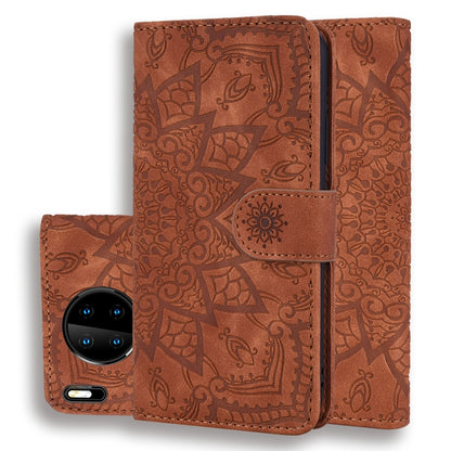 Brown embossed sunflower flip wallet case with front phone camera visible and center strap
