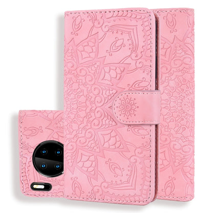 Pink embossed sunflower flip wallet case with front phone camera visible and center strap