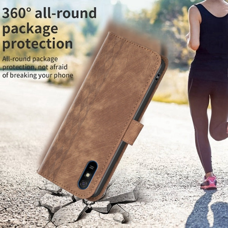 Brown plaid-embossed leather phone case with folio cover and camera opening