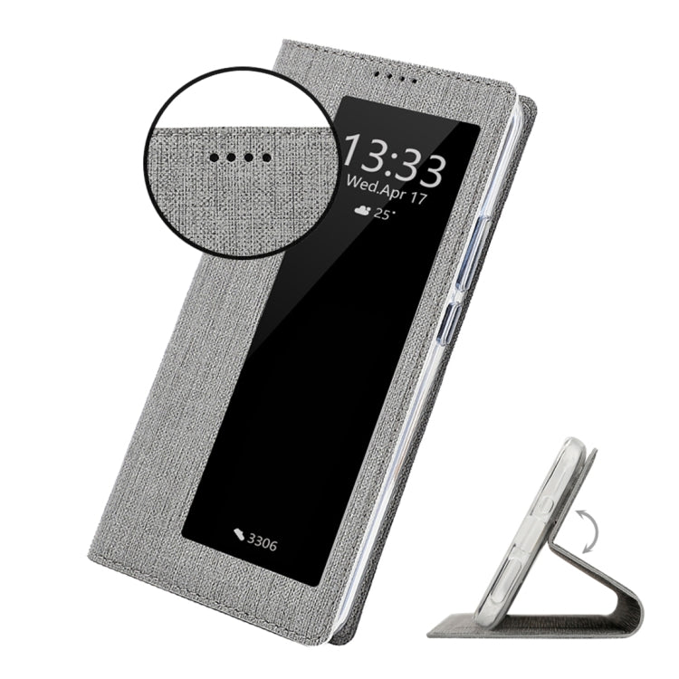 Grey flip phone case with front display window and kickstand viewing support