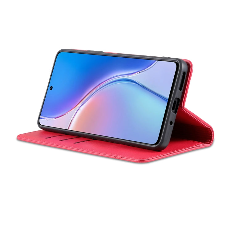 Red magnetic flip leather phone case standing with folio cover on a phone.