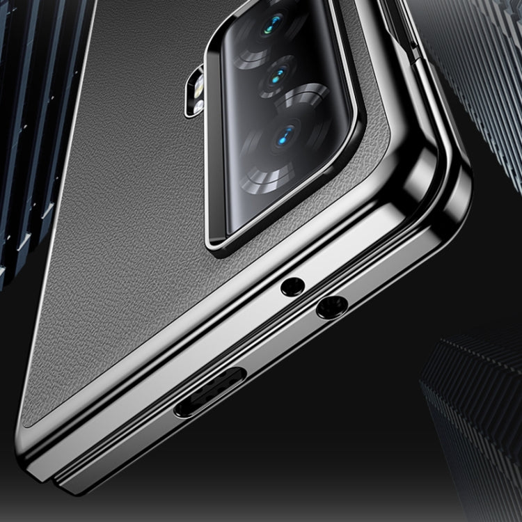 Dark textured leather folding phone case with metallic edge and camera cutout