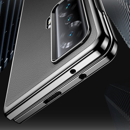 Dark textured leather folding phone case with metallic edge and camera cutout