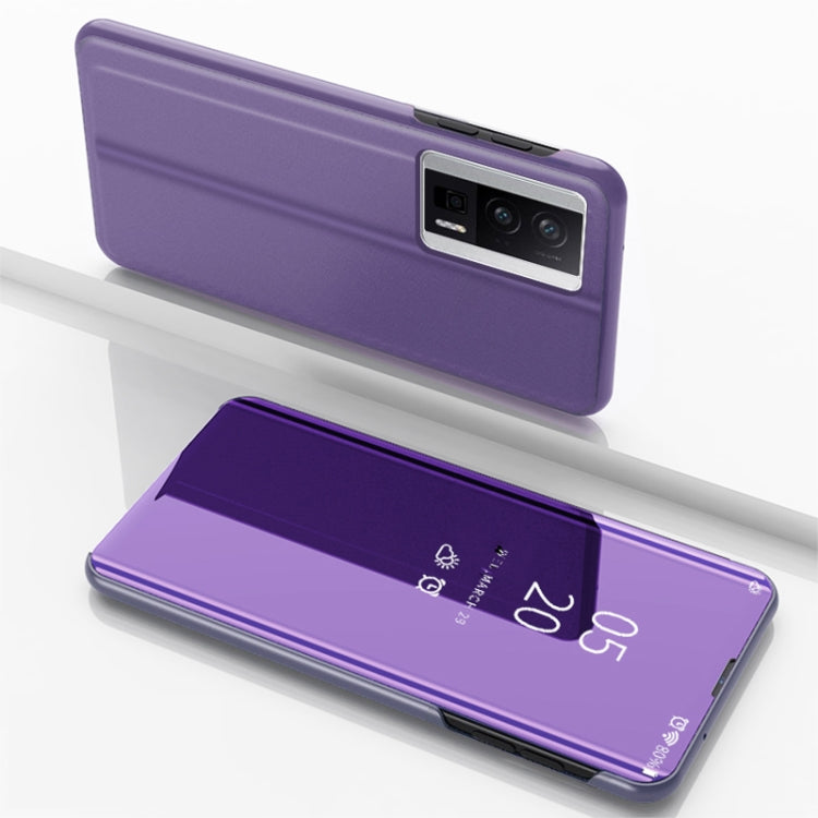Purple flip phone case with mirror kickstand, leather-style, closed-back view.