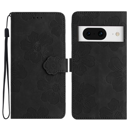 Black flower-embossed leather phone case with folio flap and wrist strap