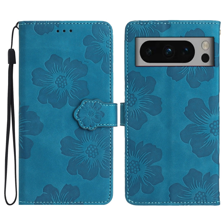 Blue flower-embossed leather phone case with folio flap and wrist strap