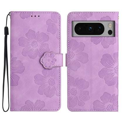 Purple flower-embossed leather phone case with folio flap and wrist strap