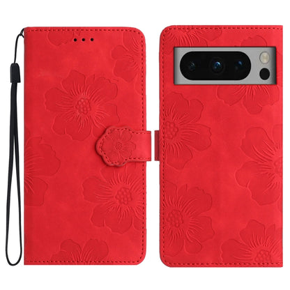 Red flower-embossed leather phone case with folio flap and wrist strap