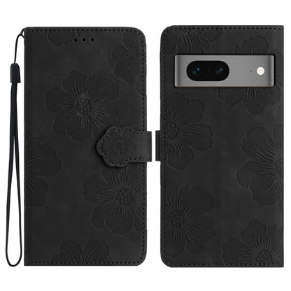 Black embossed flower leather phone case with flip cover and wrist strap.
