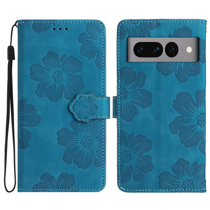 Blue embossed flower leather phone case with flip cover and wrist strap.