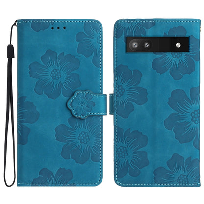 Blue embossed floral leather phone case with flip cover and camera cutout.
