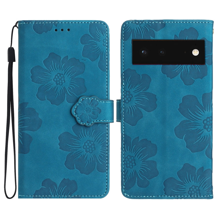 Blue floral embossed leather-style phone case with flip cover and wrist strap
