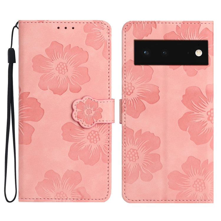 Pink floral embossed leather-style phone case with flip cover and wrist strap