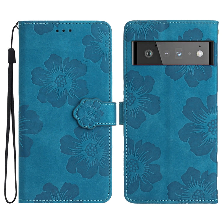 Blue floral embossed leather-style phone case with flip cover and wrist strap