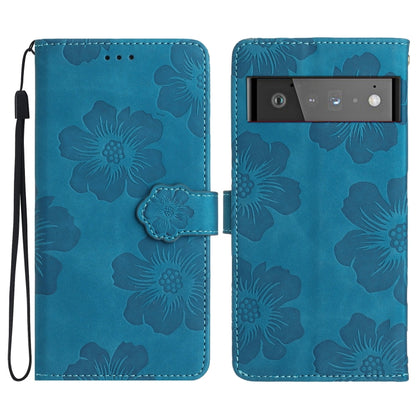 Blue floral embossed leather-style phone case with flip cover and wrist strap